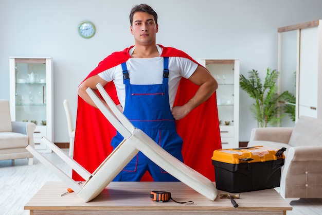 Super hero repairman working at home Premium Photo