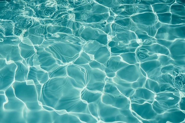青いプールテクスチャ背景 スイミングプールの水面 プレミアム写真