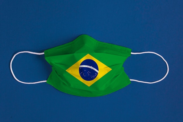 Download Free Download This Surgical Mask On Blue Background With Brazilian Flag Use our free logo maker to create a logo and build your brand. Put your logo on business cards, promotional products, or your website for brand visibility.