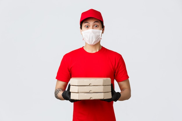 Premium Photo Surprised Asian Delivery Guy Look Embarrassed As Someone Opened Door Naked Holding Pizza As Clients Made Order From Food Deliver App Courier In Red Cap And T Shirt Uniform Medical