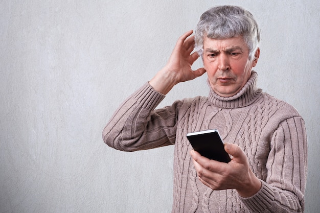 Premium Photo A Surprised Elderly Man Being Shocked To Watch News