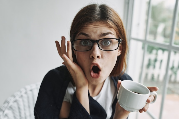 Premium Photo | Surprised woman with wide open mouth and glasses