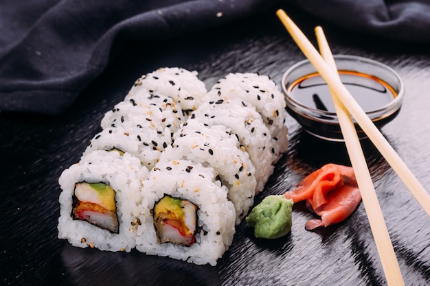 Premium Photo | Sushi roll served with wasabi and ginger