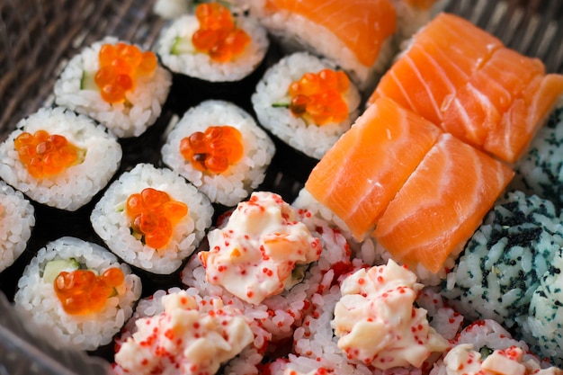 Sushi roll with salmon and caviar fish Premium Photo