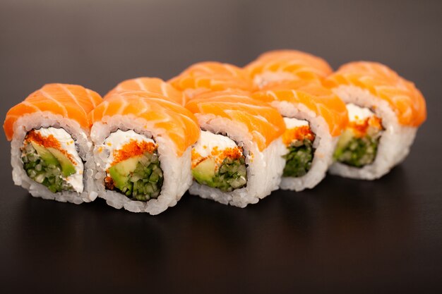 Premium Photo Sushi Roll With Salmon Cheese And Avocado