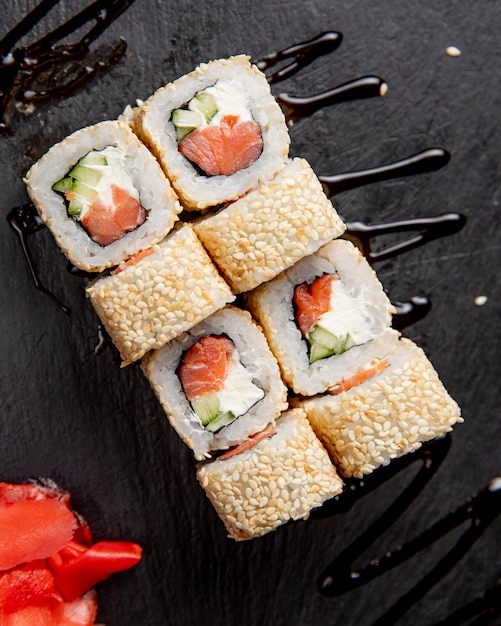 Free Photo | Sushi rolls with sesame seeds served with ginger