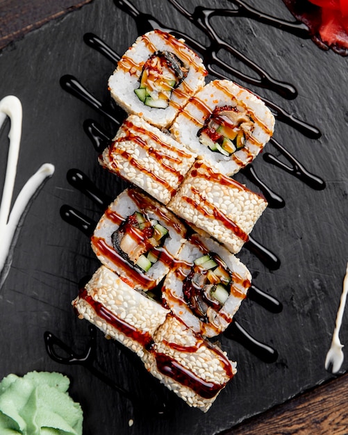 Free Photo | Sushi rolls with sesame seeds served with sauce and wasabi