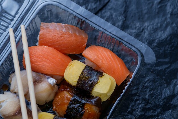 Premium Photo | Sushi in take out box