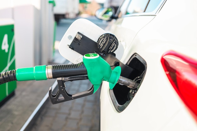 Premium Photo | Suv big car refueling at petrol gas station to filling ...