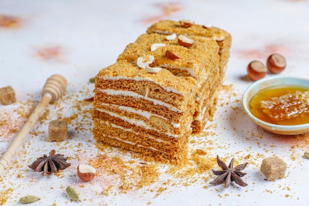 Free Photo | Sweet homemade layered honey cake with spices and nuts.