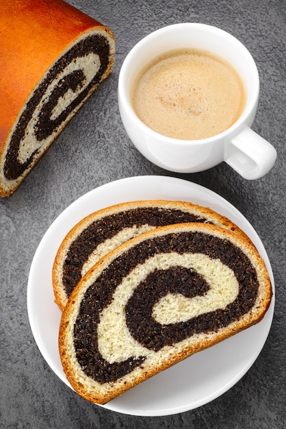 Premium Photo Sweet Roll Filled With Poppy Seed And Cup Of Coffee