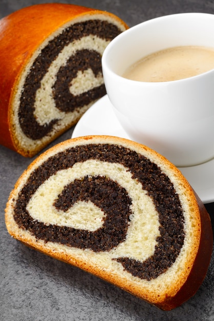 Premium Photo Sweet Roll Filled With Poppy Seed And Cup Of Coffee