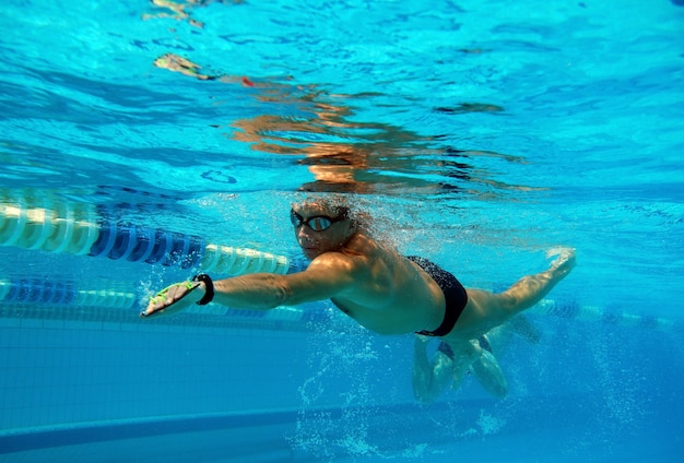 Premium Photo | Swimmer in the big outdoor swimming pool