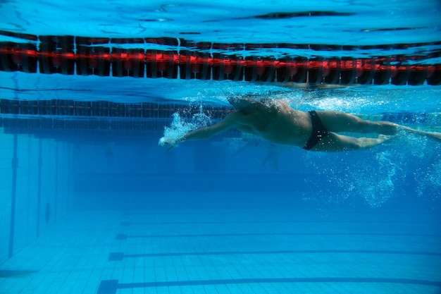 Premium Photo | Swimmer in the big outdoor swimming pool