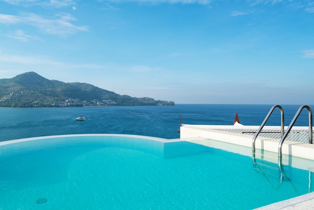 Premium Photo Swimming Pool With Stair On Top Of Roof Deck Building Looking At View Tropical Sea