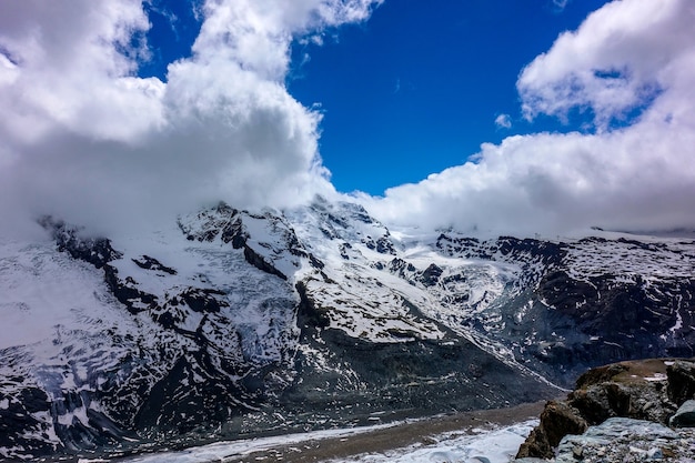 Premium Photo | Switzerland snow mountain with blue sky.