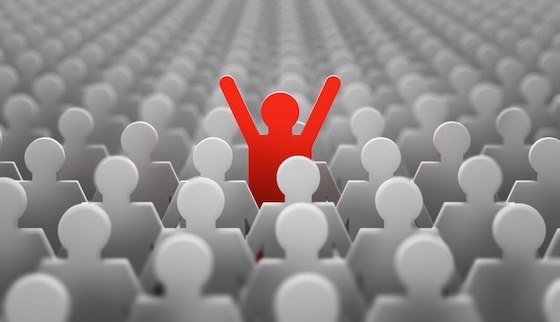 The symbol of a leader in the form of a red man with his hands up in a crowd of white men Premium Photo