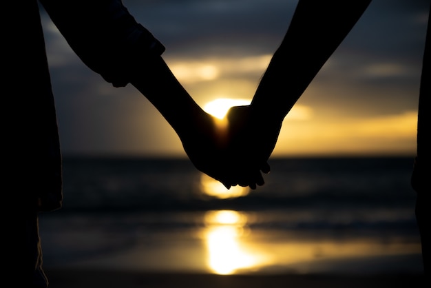 Premium Photo Symbols Of Love Silhouette Couple Of Man And Woman Hand Holding Together