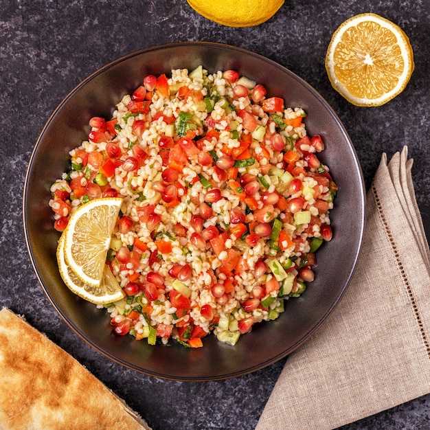 Premium Photo | Tabbouleh salad in a bowl with lemon