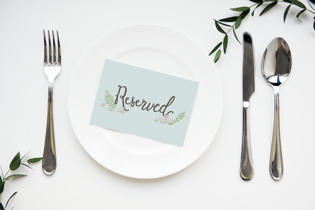 Table setting with reserved card Premium Photo