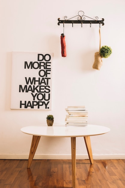 Table With Books And Plant In Stylish Room Photo Free Download