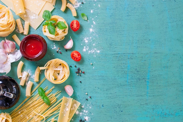 Table with variety of pasta and tomato sauce Free Photo Table with variety of pasta and tomato sauce Free Photo