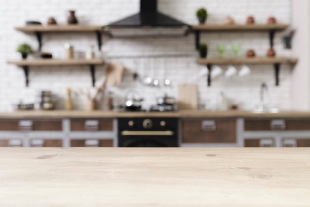 Tabletop with stylish modern kitchen in background Premium Photo