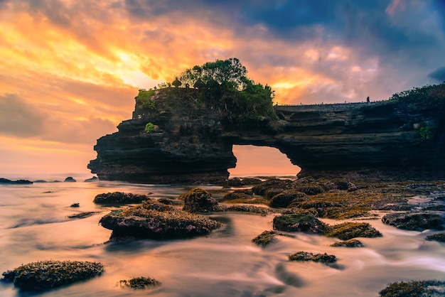  Tanah  lot  temple on sea at sunset  in bali island Premium 