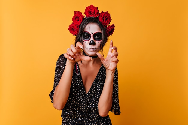 Free Photo | Tanned pretty girl with halloween makeup standing on ...