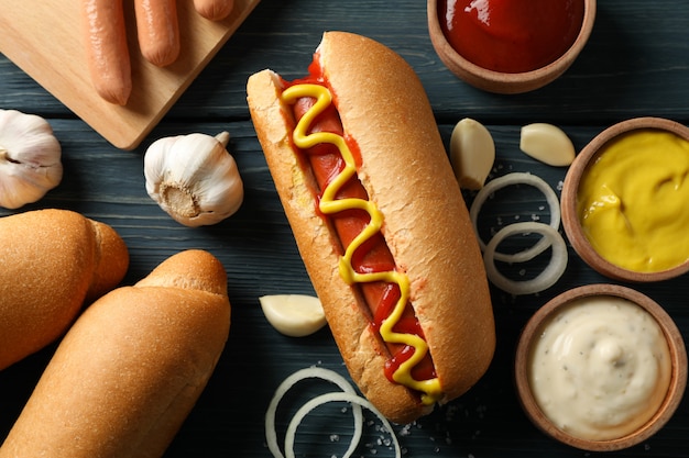 premium-photo-tasty-hot-dog-and-ingredients-on-wooden-surface