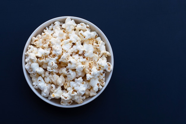 Premium Photo | Tasty popcorn on dark background