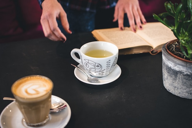 Tea and coffee break with a book | Free Photo