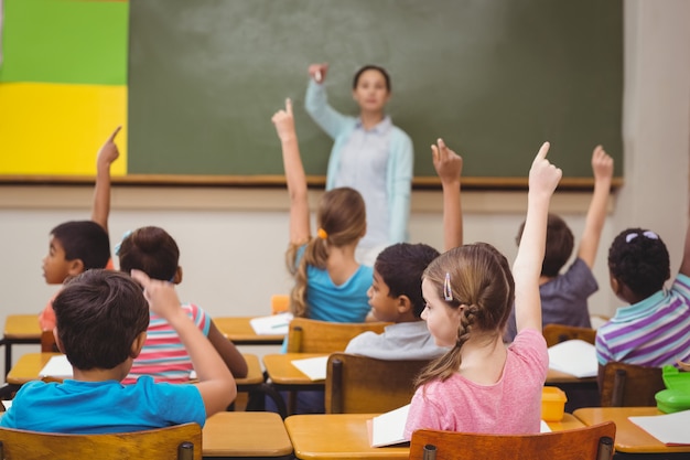 Premium Photo | Teacher asking a question to her class