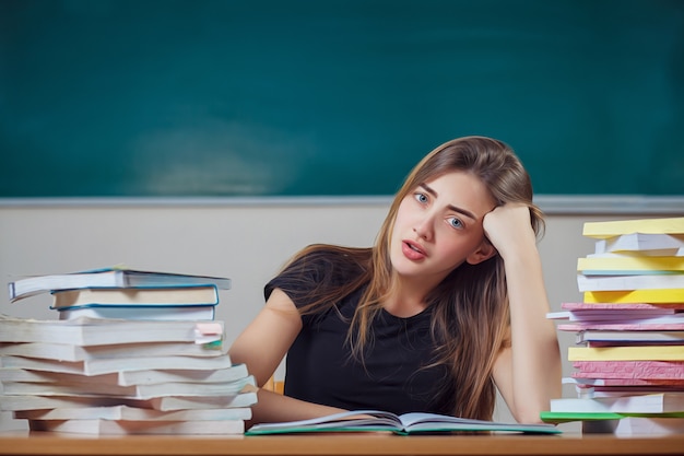 Premium Photo | Teacher surrounded by books in a school classroom