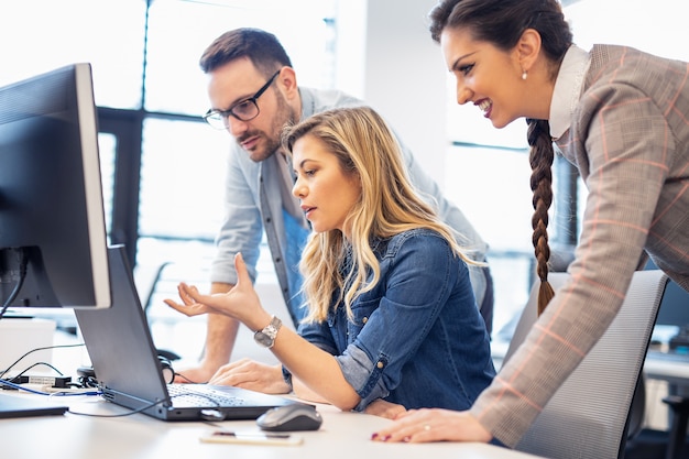 Premium Photo | Team colleagues working together on laptop