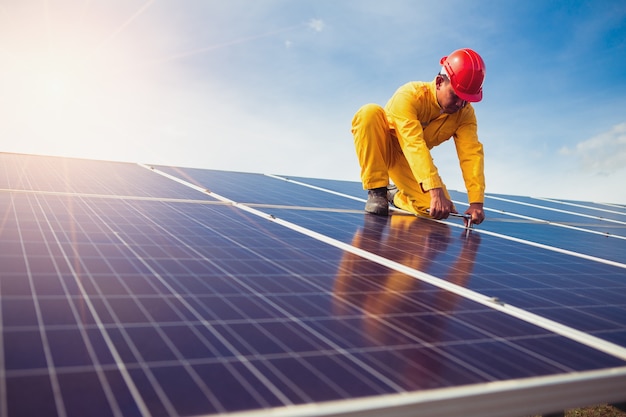 Premium Photo | The technician is repairing the solar panel