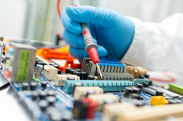 Premium Photo | Technician repairing inside of hard disk by soldering iron.