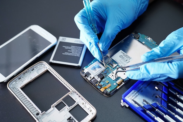 Premium Photo | Technician repairing micro circuit main board of