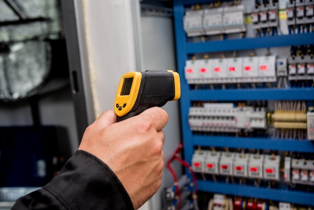 Premium Photo | Technician use infrared thermal imaging camera to check ...