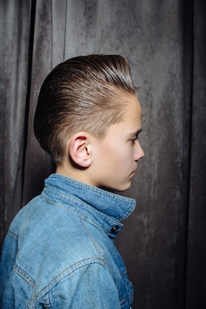 Teenage Boy Haircuts Hairdresser In The Barber Shop Premium Photo