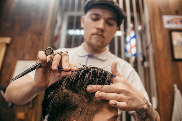 Premium Photo | Teenage boy haircuts hairdresser in the barber shop