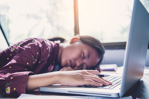 Premium Photo | Teenage fatigue for work with laptop