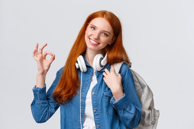 girl holding backpack