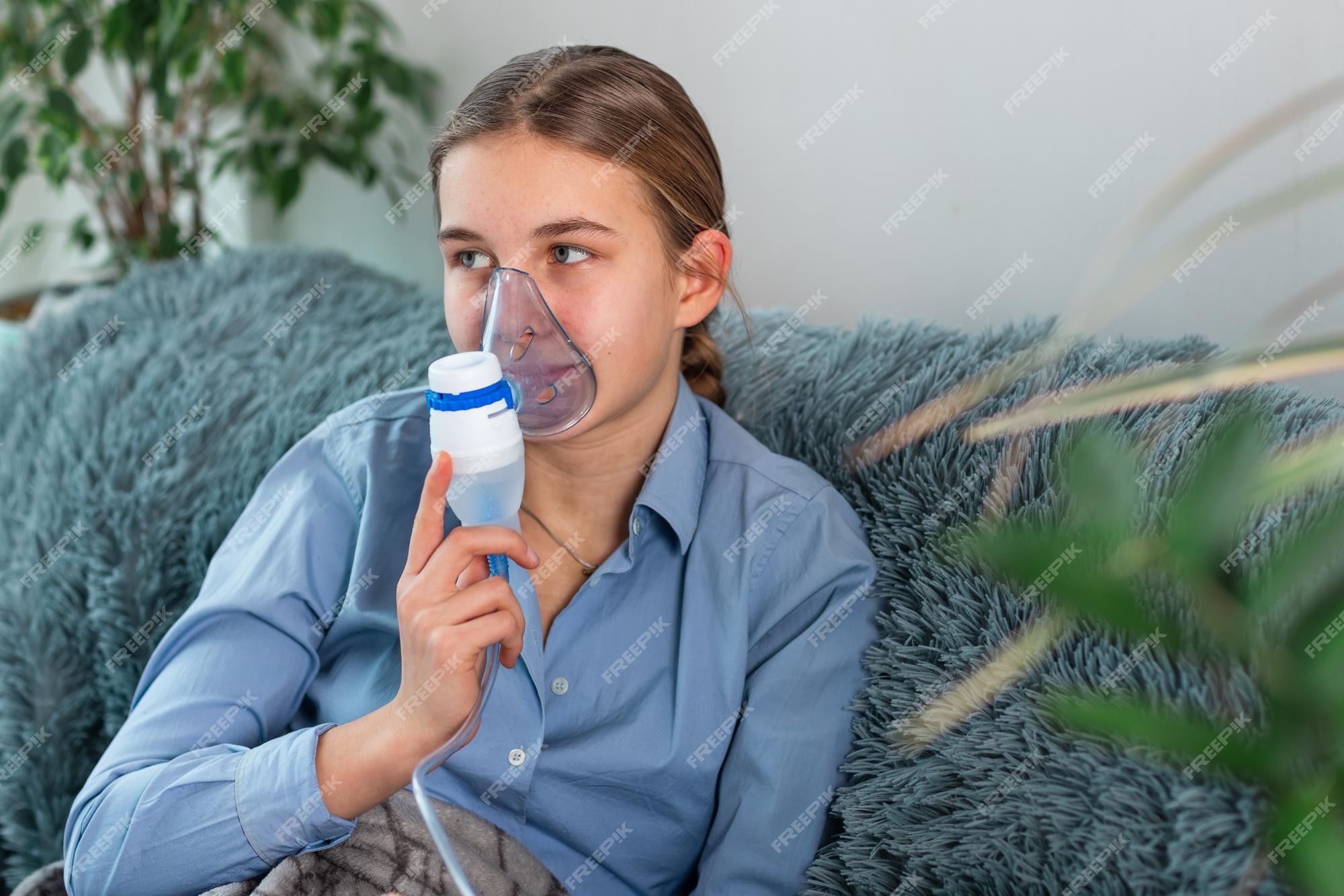 Premium Photo | Teenage girl makes inhalation with a nebulizer ...