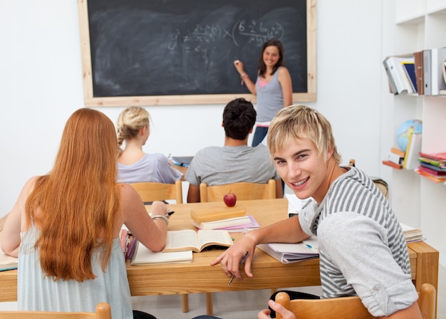 Premium Photo | Teenagers studying together in a class