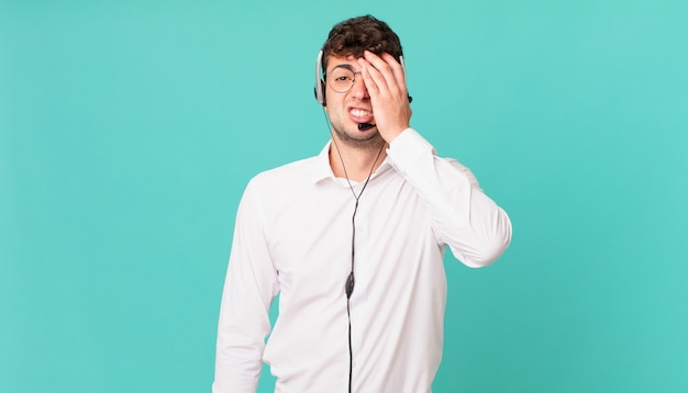 Premium Photo | Telemarketer feeling bored, frustrated and sleepy after ...