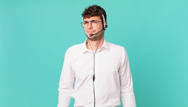 Premium Photo | Telemarketer feeling sad, upset or angry and looking to ...