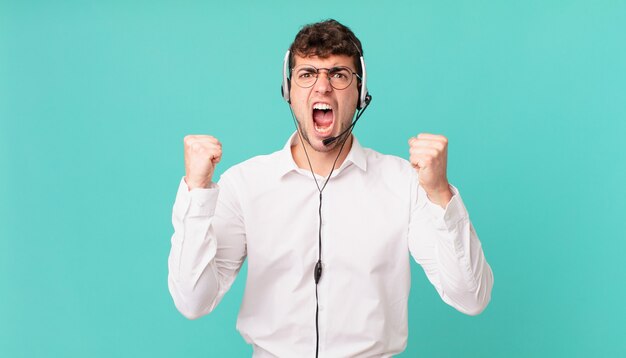 Premium Photo | Telemarketer shouting aggressively with an angry ...