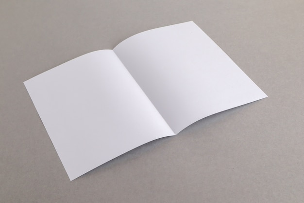 Premium Photo | Template fold white paper on gray background bussnese ...