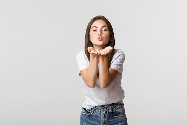 Free Photo Tender Attractive Young Woman Blowing Air Kiss At Camera Flirty